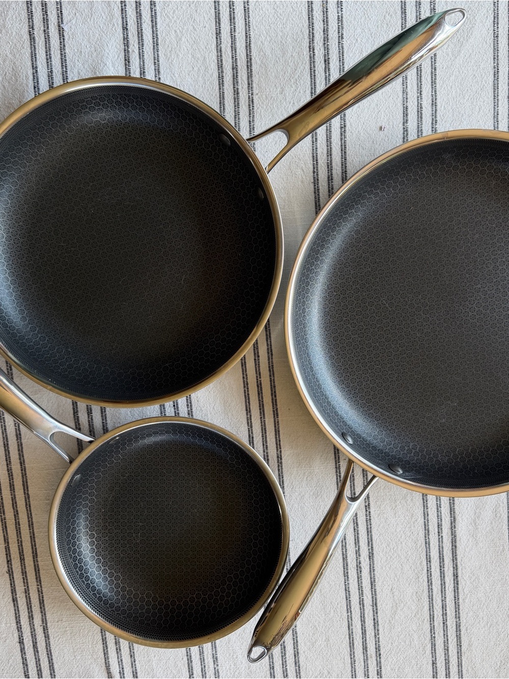 Hexclad Brand Nonstick Frying Pan Set with Stainless Handles.